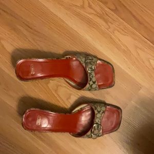 Coach Slippers in red and brown monogram.
